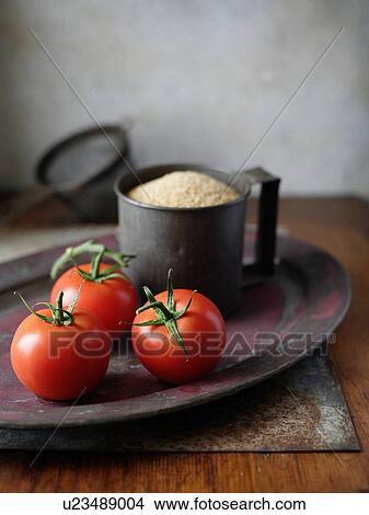 Picture - Vine tomatoes and cous cous. Fotosearch