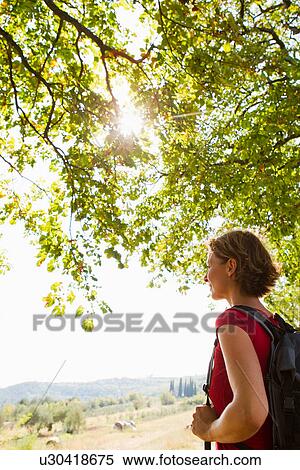 Woman looking at rural scene View Large Photo Image Stock Photography - Woman looking at rural scene. Fotosearch