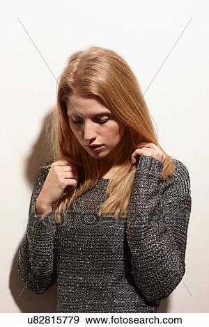 Stock Photo - Woman looking down. Fotosearch