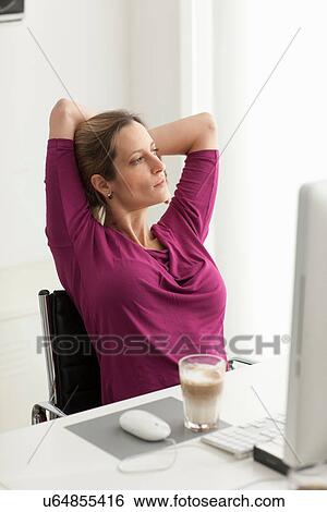 Woman looking out of window with hands behind head View Large Photo Image Stock Photograph - Woman looking out of window with hands behind head. Fotosearch