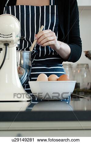 Woman stirring cake mixture View Large Photo Image Stock Image - Woman stirring cake mixture. Fotosearch