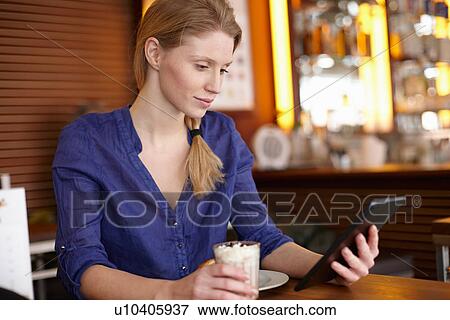 Woman using digital tablet View Large Photo Image Stock Photo - Woman using digital tablet. Fotosearch