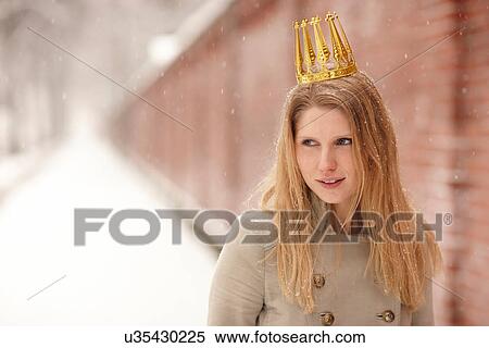 Woman wearing crown with brick wall behind her View Large Photo Image Stock Photography - Woman wearing crown with brick wall behind her. Fotosearch