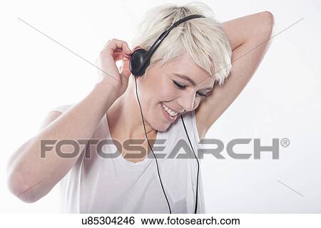 Woman wearing earphones View Large Photo Image Stock Photograph - Woman wearing earphones. Fotosearch