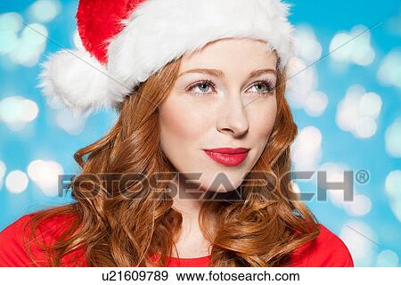 Woman wearing santa hat View Large Photo Image Stock Photo - Woman wearing santa hat. Fotosearch