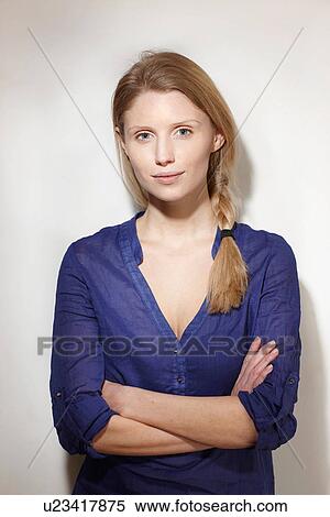 Woman with arms folded View Large Photo Image Stock Photography - Woman with arms folded. Fotosearch
