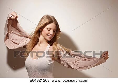 Woman with arms out-stretched View Large Photo Image Stock Photo - Woman with arms out-stretched. Fotosearch