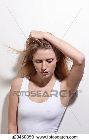 Stock Photo - Woman with arms over head. Fotosearch