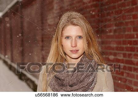 Woman with brick wall behind her View Large Photo Image Stock Photograph - Woman with brick wall behind her. Fotosearch