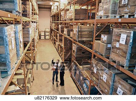 Worker and supervisor in warehouse View Large Photo Image Stock Photo - Worker and supervisor in warehouse. Fotosearch