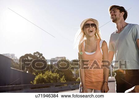 Picture - Young couple having fun. Fotosearch