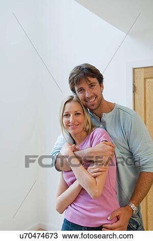 Stock Image - Young couple hugging. Fotosearch