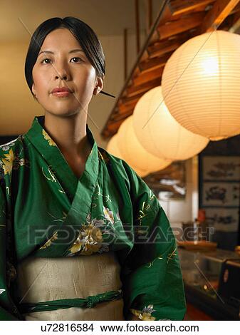 Picture - Young woman wearing traditional Asian clothing. Fotosearch