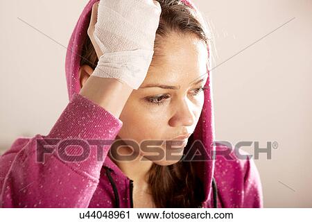 Young woman with bandage on wrist View Large Photo Image Stock Image - Young woman with bandage on wrist. Fotosearch