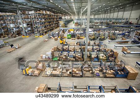 Stock Photo - Assembling orders in distribution warehouse. Fotosearch