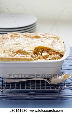 Stock Image - Baked chicken and vegetable pie. Fotosearch