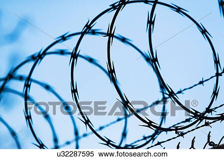 Stock Photography - Barbed wire fence. Fotosearch