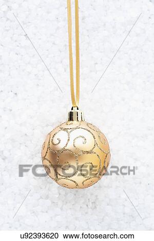 Beige bauble with gold swirls View Large Photo Image Stock Image - Beige bauble with gold swirls. Fotosearch