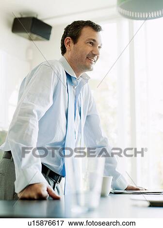 Businessman in kitchen View Large Photo Image Stock Photo - Businessman in kitchen. Fotosearch