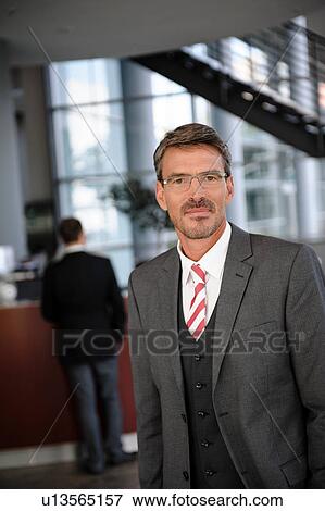 Stock Photo - Businessman waiting in reception area. Fotosearch