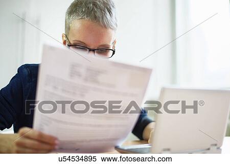 Businesswoman with paperwork View Large Photo Image Stock Photography - Businesswoman with paperwork. Fotosearch