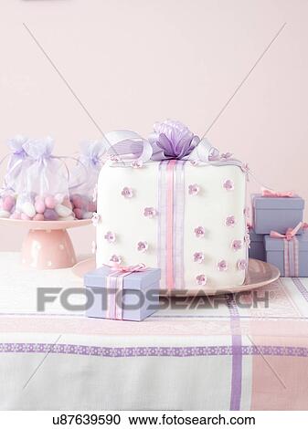 Stock Image - Celebration cake in the shape of a gift. Fotosearch