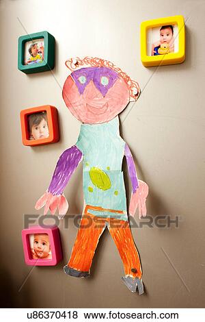 Childhood photographs and picture on wall View Large Photo Image Stock Photo - Childhood photographs and picture on wall. Fotosearch
