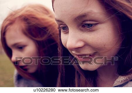 Close up of young friends outdoors View Large Photo Image Stock Image - Close up of young friends outdoors. Fotosearch