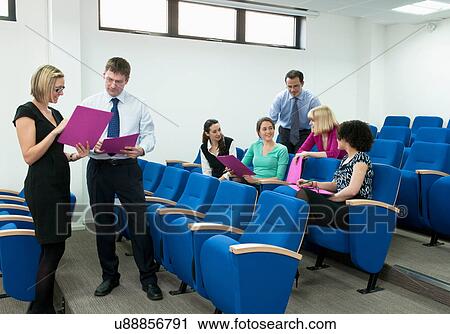 Colleagues in presentation View Large Photo Image Stock Image - Colleagues in presentation. Fotosearch