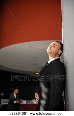 Contented mid adult businessman View Large Photo Image Stock Image - Contented mid adult businessman. Fotosearch