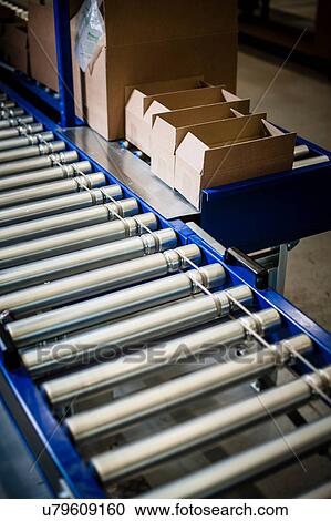 Detail of stationary conveyer belt in distribution warehouse View Large Photo Image Stock Image - Detail of stationary conveyer belt in distribution warehouse. Fotosearch