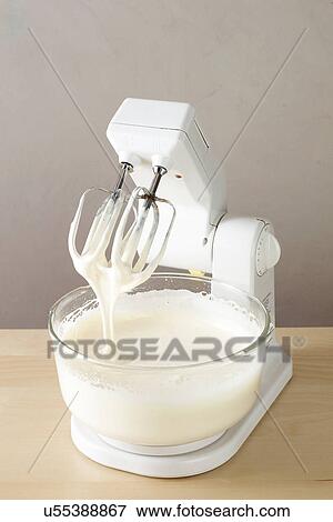 Electric mixer and bowl of cream View Large Photo Image Stock Photo - Electric mixer and bowl of cream. Fotosearch