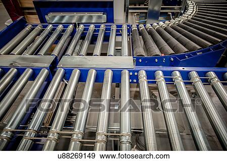 Empty conveyer belt in distribution warehouse View Large Photo Image Stock Photo - Empty conveyer belt in distribution warehouse. Fotosearch