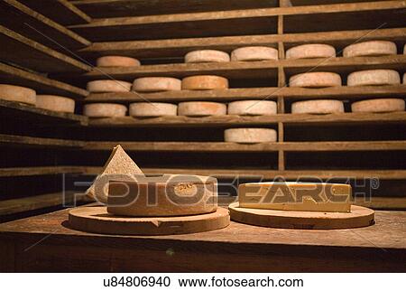 Fresh cheese wheels on table in cabin View Large Photo Image Stock Image - Fresh cheese wheels on table in cabin. Fotosearch