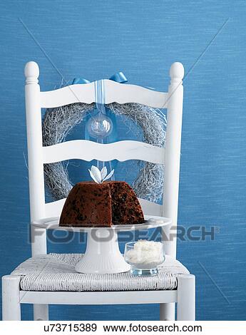 Fruitcake on cake stand on white chair View Large Photo Image Stock Photo - Fruitcake on cake stand on white chair. Fotosearch