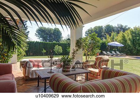 Stock Photo - Garden terrace of luxury villa. Fotosearch