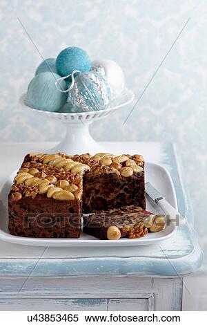 Stock Photography - Irish Fruitcake with walnuts, macadamias and brazil nuts. Fotosearch