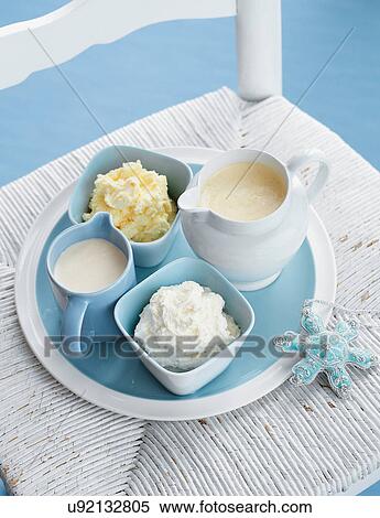 Stock Photography - Jugs and bowls of sauces and buttercream. Fotosearch