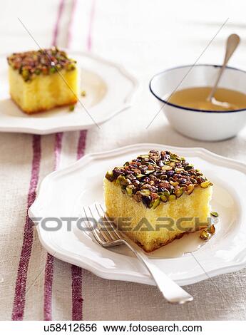 Lemon syrup cake with pistachios View Large Photo Image Stock Photograph - Lemon syrup cake with pistachios. Fotosearch