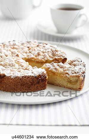 Lemon teacake with slice cut and cup of tea View Large Photo Image Picture - Lemon teacake with slice cut and cup of tea. Fotosearch