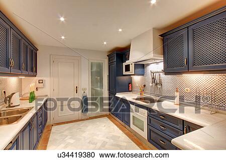 Stock Image - Luxury kitchen in wealthy home. Fotosearch