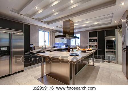 Stock Photograph - Luxury kitchen in wealthy home. Fotosearch