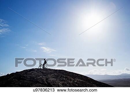 Stock Image - Man mountain biking, Pica del Cuchillo, Lanzarote. Fotosearch