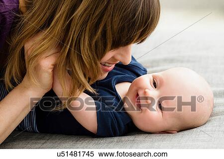 Mother and baby son face to face View Large Photo Image Stock Photography - Mother and baby son face to face. Fotosearch
