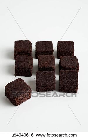 Nine chocolate brownies arranged in square View Large Photo Image Stock Photograph - Nine chocolate brownies arranged in square. Fotosearch