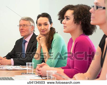 Office colleagues in meeting View Large Photo Image Stock Image - Office colleagues in meeting. Fotosearch
