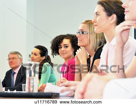 Stock Photo - Office colleagues in meeting. Fotosearch