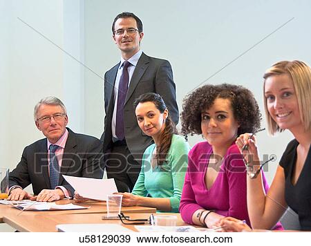 Office colleagues in meeting View Large Photo Image Stock Photo - Office colleagues in meeting. Fotosearch