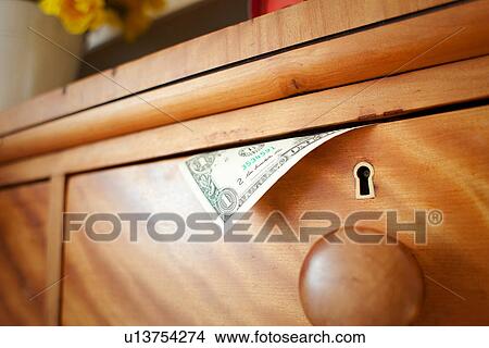 One dollar bill in drawer, close up View Large Photo Image Picture - One dollar bill in drawer, close up. Fotosearch