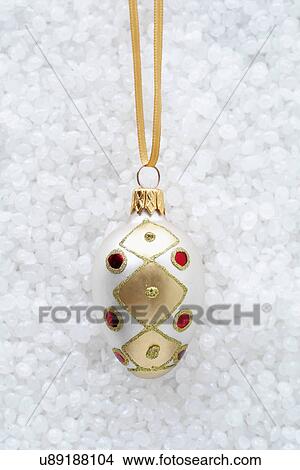 Picture - Oval bauble with red jewels. Fotosearch